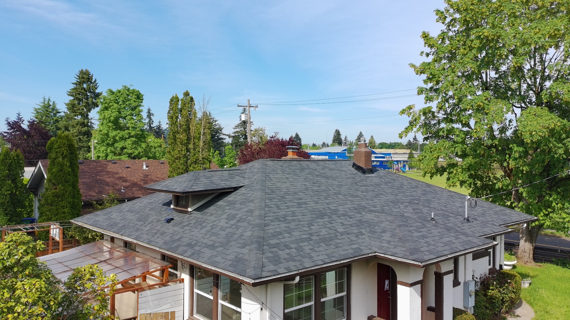 Aerial view of completed charcoal shingle roof replacement by Firu Construction LLC — Salem, OR